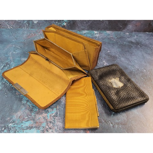 216 - An early 20th century red morocco leather stationery case,  writing surface, stamp and paper pouches... 