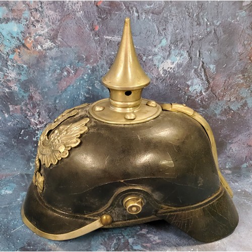 263 - A World War I German Pickelhaube spiked helmet leather skull,  original lining  spike top, pressed m... 