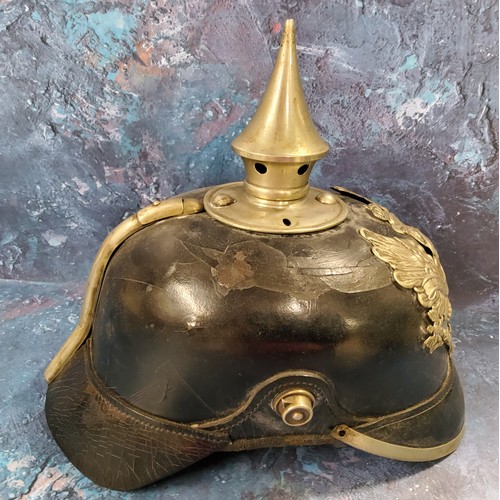 263 - A World War I German Pickelhaube spiked helmet leather skull,  original lining  spike top, pressed m... 