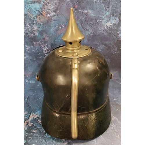 263 - A World War I German Pickelhaube spiked helmet leather skull,  original lining  spike top, pressed m... 