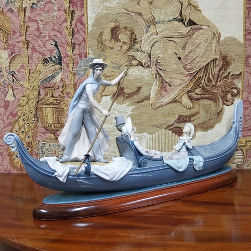 291 - A large Lladro figural group 'In The Gondola' modelled by Francisco Catala with gondolier and elegan... 