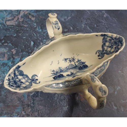 320 - A Worcester  double handled sauceboat,  lobed and moulded, painted with the Two-Handled Sauceboat La... 