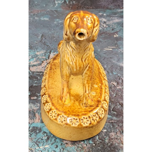 350 - A Derbyshire salt glazed stoneware model, of a long haired dog, oval base, 14cm wide, c.1860