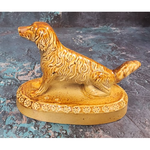 350 - A Derbyshire salt glazed stoneware model, of a long haired dog, oval base, 14cm wide, c.1860