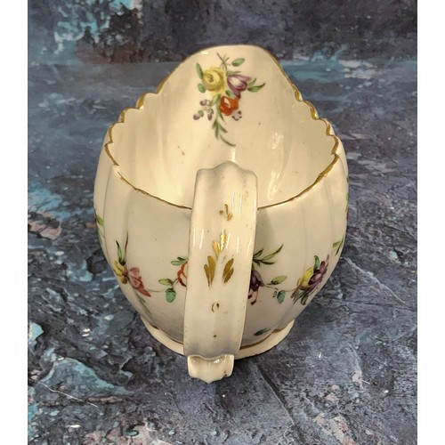 364 - A Bristol  fluted sauceboat,  painted with floral swags, outlined in gilt,  the spout with leafy wre... 