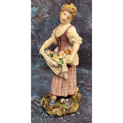 368 - A Bristol figure,  of a girl holding flowers in her apron, in colours, 20cm high, c.1775