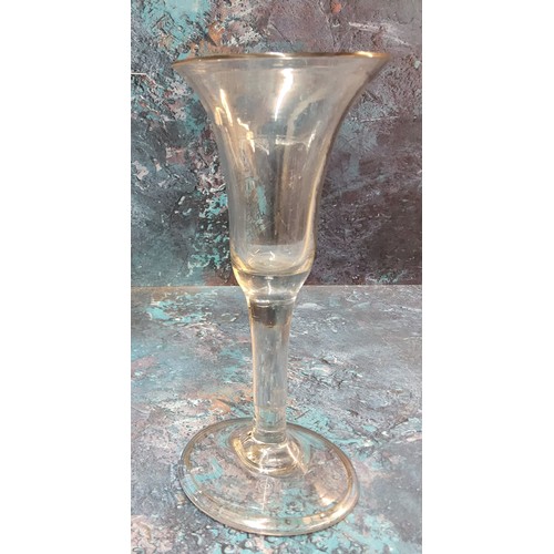 375 - An 18th century English wine glass, flared bowl, clear stem, folded foot, 16cm high, c.1740