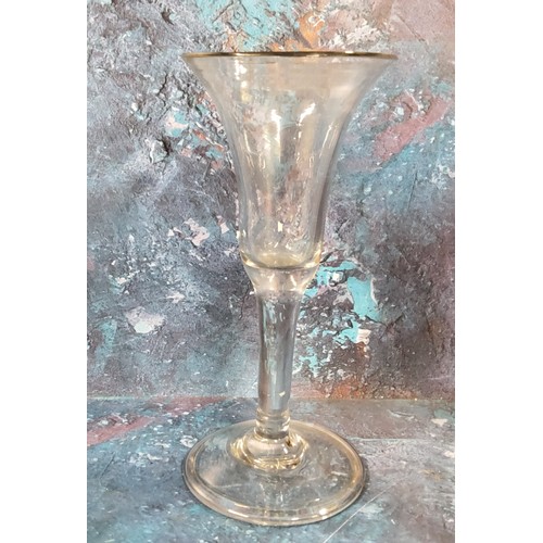 375 - An 18th century English wine glass, flared bowl, clear stem, folded foot, 16cm high, c.1740