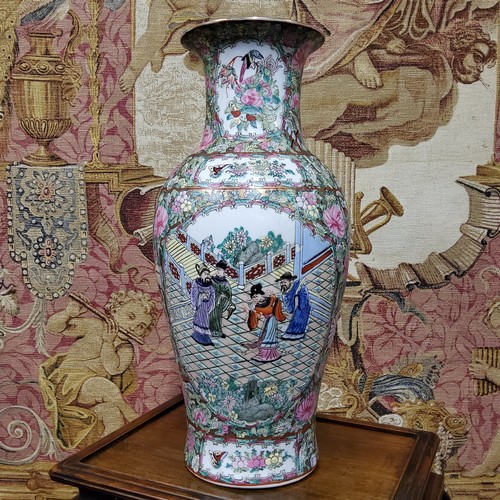 406 - A pair of Canton Famille Rose vases, polychrome decorated with a border of chrysanthemums, roses, bi... 