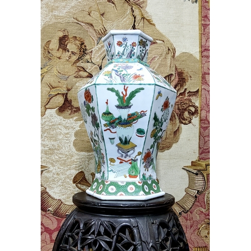 411 - A Chinese famille verte hexagonal vase,  the hexagonal baluster form, decorated with panels of antiq... 