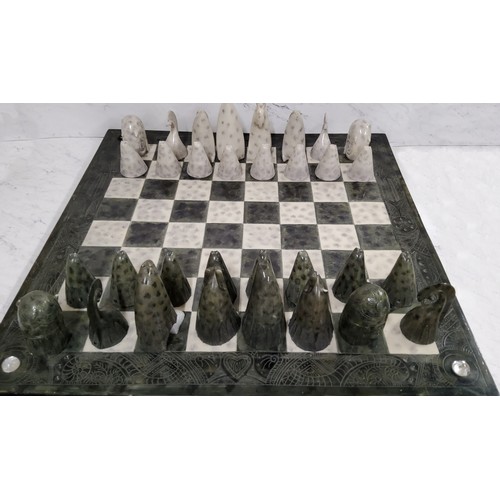 434 - Govinder Nazran (1964-2008, British), a chess set, each piece as a stylised animal, the board 62cm s... 