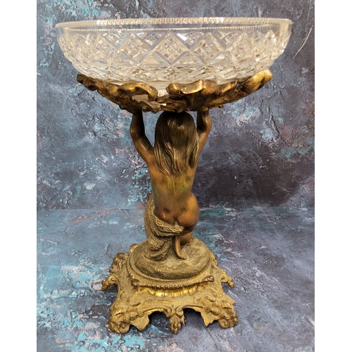 493 - A 19th century bronze and glass figural table centrepiece, clear glass bowl supported by a scantilly... 