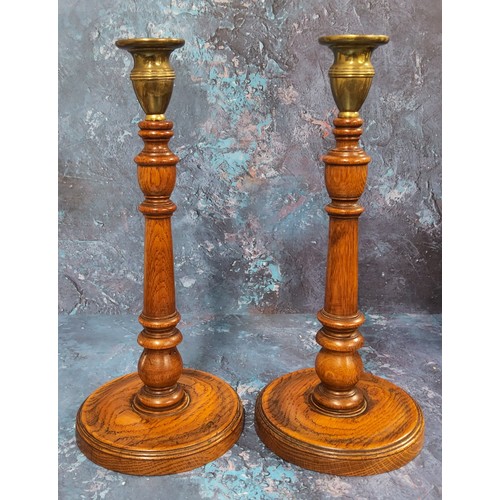 503 - A pair of 19th century brass and oak candlesticks, knopped and turned columns, circular bases, 31.5c... 