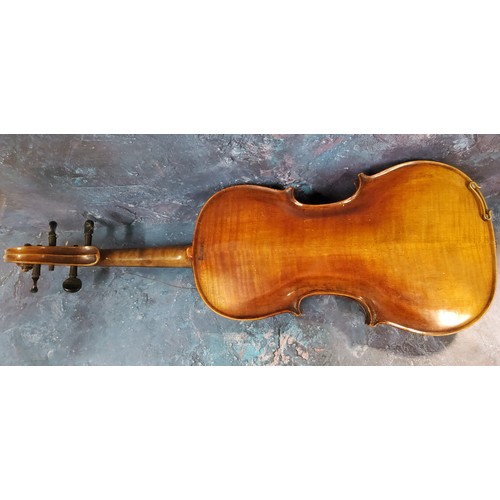 555 - A late 19th century violin, two piece back,  stamped Stainer,  length 37cm long, c.1890;  two bows