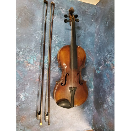 555 - A late 19th century violin, two piece back,  stamped Stainer,  length 37cm long, c.1890;  two bows