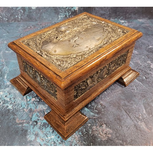 559 - An Edwardian silver mounted and oak jewellery box, the cover and sides embossed with panels of stag ... 