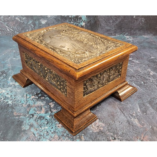 559 - An Edwardian silver mounted and oak jewellery box, the cover and sides embossed with panels of stag ... 