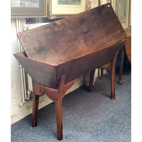 561 - An early 19th century elm and fruitwood dough bin, rounded rectangular top, chipped carved edges, ca... 