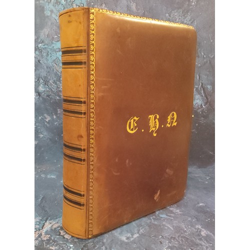 665 - A Victorian leather photograph album, the cover with initials in gilt, tooled border, twenty leaves,... 