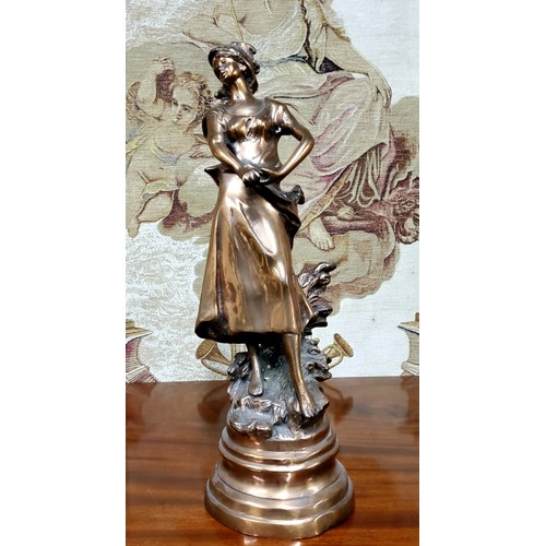 666 - A 19th century French bronze of a lady during the harvest, raised on a later base, 55cm high