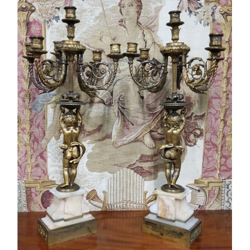 670 - A good pair of 19th century gilt bronze and alabaster five branch, six light candelabras, the ornate... 