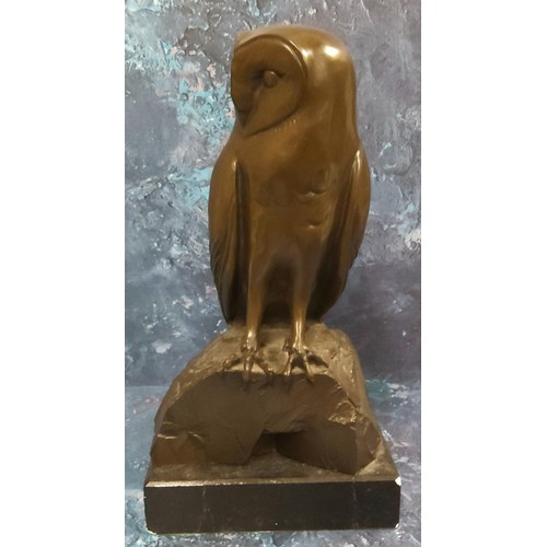 659 - English School, 20th century, brown patinated bronzed, Owl, on a rock, rectangular base, 34cm high