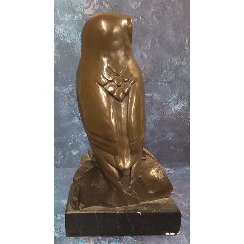 659 - English School, 20th century, brown patinated bronzed, Owl, on a rock, rectangular base, 34cm high