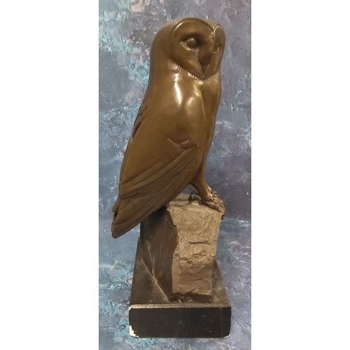 659 - English School, 20th century, brown patinated bronzed, Owl, on a rock, rectangular base, 34cm high