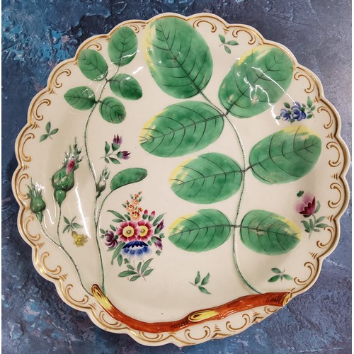 374 - A Worcester Blind Earl pattern shaped circular plate, in relief with leaves and buds, painted with f... 