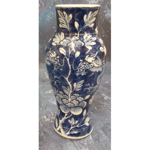 413 - A Chinese vase, decorated in underglaze blue with scrolling dragons and peonies, 15.5cm high, four c... 