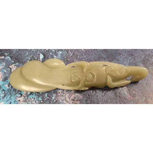 415 - A Chinese celedon jade carving/wrist rest, 14cm wide