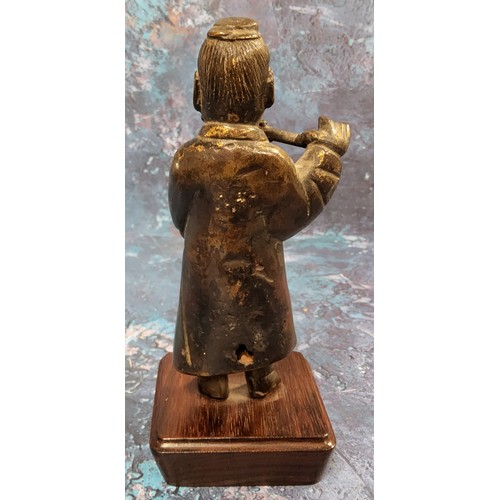 418 - Chinese School, possibly 17th century, a dark patinated bronze, of a musician playing a flute, late ... 