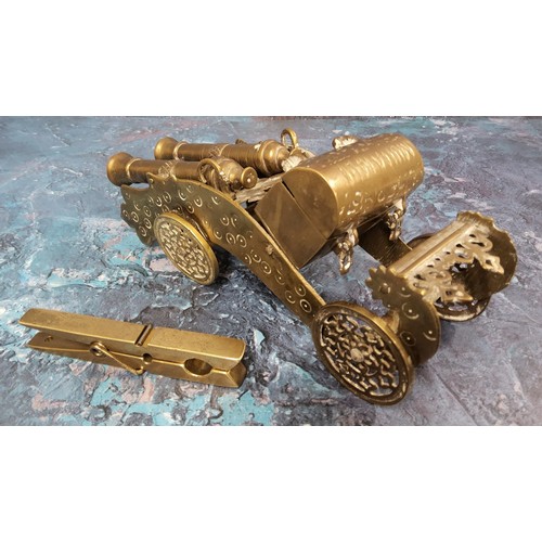 420 - A novelty table snuff in form of a double cannon, by scroll shaped chassis on four disc wheels, the ... 