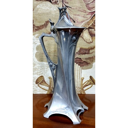 468 - A W.M.F. Art Nouveau Jugendstilpewter jug, of spreading cylindrical form, the hinged domed cover wit... 