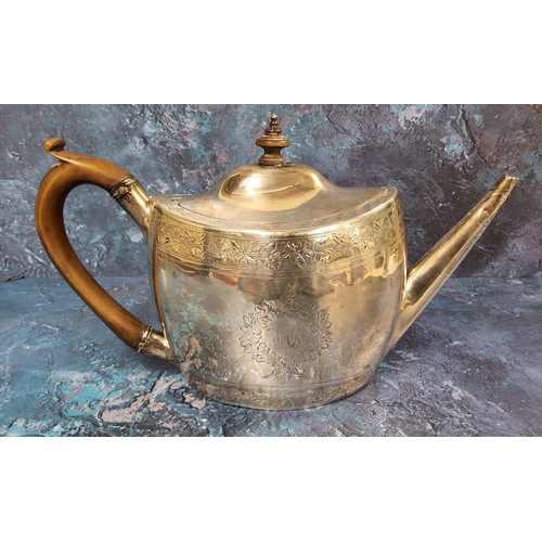 52 - A George III silver oval teapot and cover, engraved with crest and initials, banded with fruiting oa... 