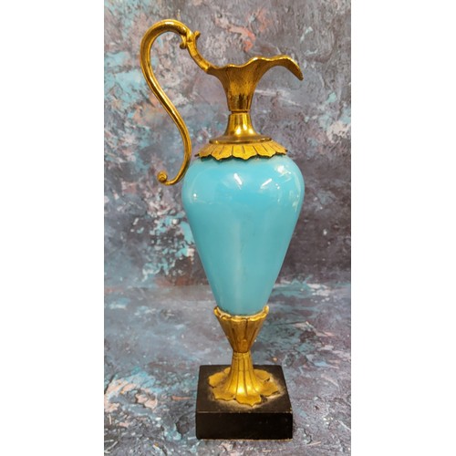 517 - A French gilt bronze mounted blue glass ewer, black square base, 21cm high