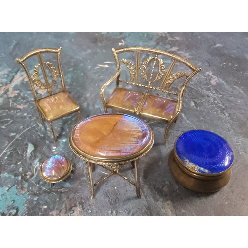 250 - A miniature silver salon sofa, chair, stool and oval table, set with butterfly wings, the sofa 5.75c... 