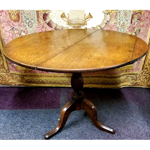 784 - A George III oak tilt top occasional table c.1800