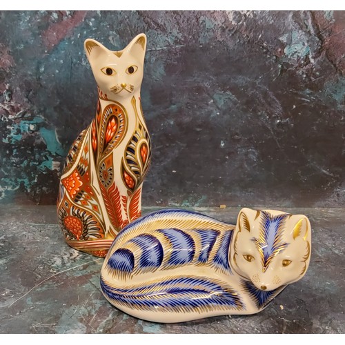 5 - A Royal Crown Derby paperweight, Siamese Cat, gold stopper;  another, Artic Fox, no stopper (2)