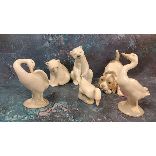 10 - A Lladro model, of a polar bear, 11.5cm high, printed mark;  another;  playful puppy; ... 