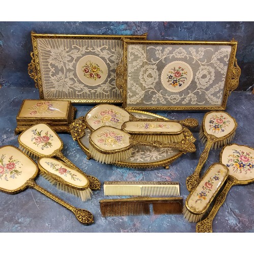 27 - A mid 20th century gilt metal dressing table set, the backs embroidered with bouquet of flowers, c.1... 