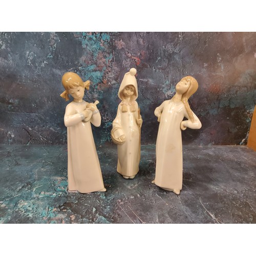 35 - A Lladro figure, of a girl playing a mandolin, 21cm high, printed mark;  others