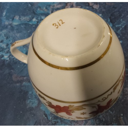 179 - A Pinxton Bute shaped teacup, pattern 312 decorated with a broad band of scrolling lilies in red and... 