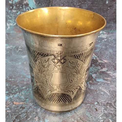 185 - A Russian silver and niello flared cylindrical beaker, engraved with buildings, 9cm high, Mikhail Di... 