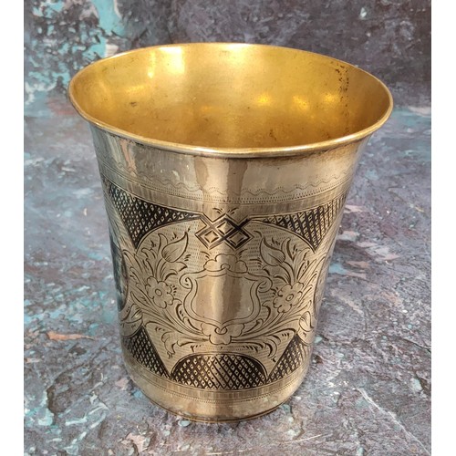 185 - A Russian silver and niello flared cylindrical beaker, engraved with buildings, 9cm high, Mikhail Di... 