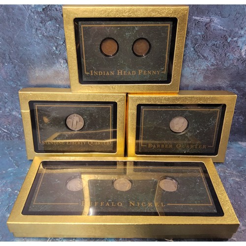 310 - Numismatics - Four presentation boxes holding American coin examples in faux marble presentation pli... 