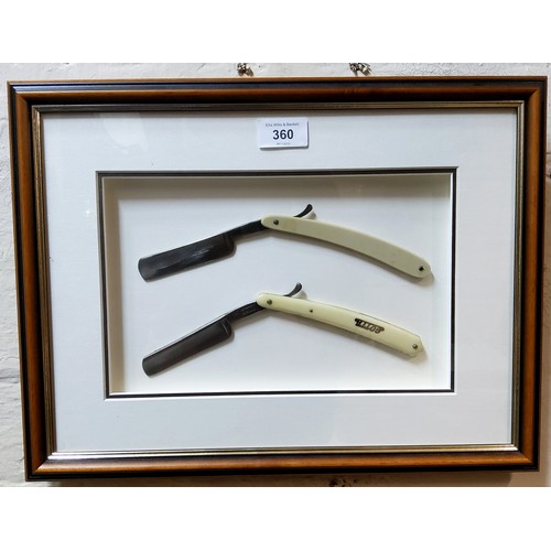 360 - A framed barber shop display of two ivorine handled cut throat razors; Gotta and 