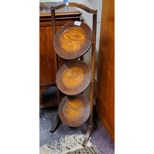 901 - An oak folding three tier cake stand, c.1930