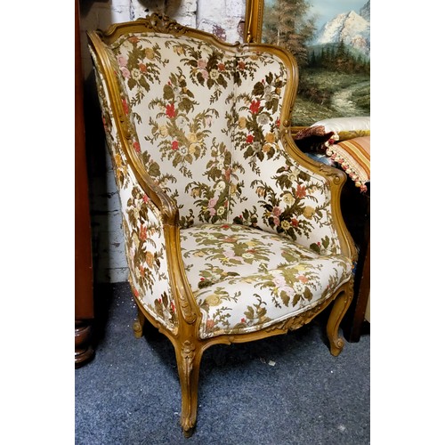 912 - A French Louis XV Revival fauteuil à oreille, the shaped cresting carved with foliage, the wingback,... 