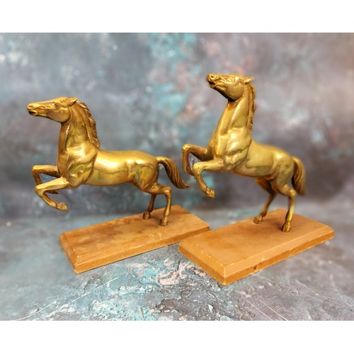 43 - A pair of brass models, rearing horses, wooden bases, 22cm high